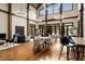Well-appointed lounge area with hardwood floors, ambient lighting, and comfortable seating for social gatherings at 1604 Falcon Ct, Locust Grove, GA 30248