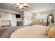 Comfortable main bedroom featuring soft carpet, a sitting area, and ensuite access at 1604 Falcon Ct, Locust Grove, GA 30248