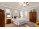 Spacious main bedroom with tray ceiling, natural light, and ample closet space at 1604 Falcon Ct, Locust Grove, GA 30248