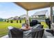 Covered patio with furniture overlooking backyard at 1604 Falcon Ct, Locust Grove, GA 30248