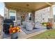 Covered patio with a grill and furniture at 1604 Falcon Ct, Locust Grove, GA 30248