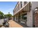 Street view of a bakery and retail building with awning and sidewalk bench at 1604 Falcon Ct, Locust Grove, GA 30248
