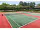 Exterior view of community tennis courts, providing an outdoor recreation area for residents to enjoy a match at 1604 Falcon Ct, Locust Grove, GA 30248