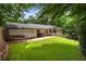 Secluded backyard with lush greenery, open patio, hammock, and plenty of room at 3042 Argonne Dr, Atlanta, GA 30305
