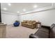 Spacious finished basement with plush carpeting, a comfortable seating area, and recessed lighting at 3042 Argonne Dr, Atlanta, GA 30305