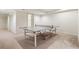 Recreational room features a table tennis setup on carpeted floor perfect for entertaining at 3042 Argonne Dr, Atlanta, GA 30305