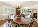 Traditional dining room boasting an antique corner cabinet, and a large window at 3042 Argonne Dr, Atlanta, GA 30305