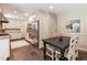 Modern kitchen with stainless steel appliances, tile floor, and adjacent dining area at 3042 Argonne Dr, Atlanta, GA 30305