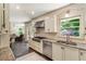 Well-equipped kitchen with stainless steel appliances, granite countertops, and ample cabinet space at 3042 Argonne Dr, Atlanta, GA 30305