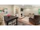Inviting living room featuring brick fireplace, built-in shelving, and comfortable seating arrangement at 3042 Argonne Dr, Atlanta, GA 30305