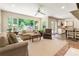 Bright open concept living room with backyard view, hardwood floors, and lots of seating space at 3042 Argonne Dr, Atlanta, GA 30305