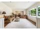 Spacious living room with hardwood floors, neutral walls, and large windows providing plenty of natural light at 3042 Argonne Dr, Atlanta, GA 30305