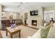 Inviting living room with fireplace, hardwood floors, and neutral tones, perfect for relaxation at 3042 Argonne Dr, Atlanta, GA 30305