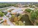 Aerial view of a brick building with a pond and fountain and a parking lot filled with cars at 834 Timberland Se St, Smyrna, GA 30080