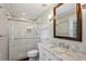Bright bathroom features a tiled shower, marble vanity, and modern fixtures at 834 Timberland Se St, Smyrna, GA 30080