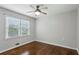 Bedroom with a ceiling fan, hardwood floors, and a large window with natural light at 834 Timberland Se St, Smyrna, GA 30080