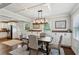 Bright dining area features coffered ceilings, modern lighting, and easy access to the kitchen at 834 Timberland Se St, Smyrna, GA 30080