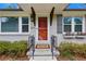 Inviting front entrance with charming details, decorative flower boxes, and a 