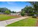 Well-maintained home with a lush green lawn, mature trees, and a concrete driveway at 834 Timberland Se St, Smyrna, GA 30080