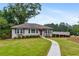 Charming single-story home with a well-manicured lawn and inviting walkway at 834 Timberland Se St, Smyrna, GA 30080