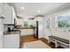 Modern kitchen with granite countertops, stainless steel appliances, and ample cabinet space at 834 Timberland Se St, Smyrna, GA 30080