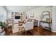 Inviting living room with a built-in bookshelf, hardwood floors, and an abundance of natural light at 834 Timberland Se St, Smyrna, GA 30080