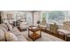 Bright living room featuring hardwood floors, neutral decor, and seamless flow to the dining area at 834 Timberland Se St, Smyrna, GA 30080