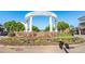Smyrna Market Village entrance with vibrant flowers at 834 Timberland Se St, Smyrna, GA 30080