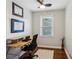 Home office with wood floors, a desk, chair, and a window with natural light at 834 Timberland Se St, Smyrna, GA 30080