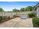 Charming backyard patio with ample seating space, surrounded by lush greenery, perfect for outdoor relaxation at 834 Timberland Se St, Smyrna, GA 30080