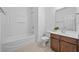 Bathroom with shower and tub combination, wood vanity, and tile floors at 3729 Inglewood Ne Way, Atlanta, GA 30319
