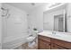 Bathroom featuring a bathtub, toilet, and vanity with dark wood cabinets at 3729 Inglewood Ne Way, Atlanta, GA 30319