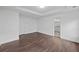 Spacious bedroom featuring hardwood floors, a large window, and neutral walls at 3729 Inglewood Ne Way, Atlanta, GA 30319