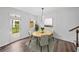 Cozy dining area with modern lighting and a view to a private outdoor deck at 3729 Inglewood Ne Way, Atlanta, GA 30319