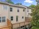 Multi-level home exterior features a wooden deck and porch at 3729 Inglewood Ne Way, Atlanta, GA 30319