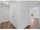Hallway with wood floors, white trim, and large closet for ample storage at 3729 Inglewood Ne Way, Atlanta, GA 30319