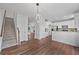 Open living area featuring hard wood floors, staircase and views to the kitchen and the living room at 3729 Inglewood Ne Way, Atlanta, GA 30319