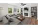 Cozy living room with a fireplace, large windows, and comfortable seating for relaxing at 3729 Inglewood Ne Way, Atlanta, GA 30319