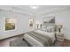 Bright main bedroom with tray ceiling, hardwood floors, and two large windows at 3729 Inglewood Ne Way, Atlanta, GA 30319