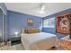 Stylish bedroom with blue walls, complemented by decor and window at 387 Ralph Mcgill Ne Blvd # K, Atlanta, GA 30312