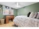 Charming bedroom featuring a desk, window, and ceiling fan, enhanced by the room's greenery at 387 Ralph Mcgill Ne Blvd # K, Atlanta, GA 30312