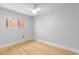 Bright bedroom with a window and ceiling fan, complemented by light hardwood floors at 387 Ralph Mcgill Ne Blvd # K, Atlanta, GA 30312