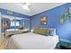 Stylish bedroom with blue walls, a mirrored closet and hanging plants at 387 Ralph Mcgill Ne Blvd # K, Atlanta, GA 30312