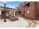 Inviting brick townhouse exterior featuring landscaped courtyard, private balconies, and well-maintained walkways at 387 Ralph Mcgill Ne Blvd # K, Atlanta, GA 30312