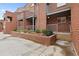 Inviting townhome exterior featuring brick facade, balconies, and neatly landscaped garden beds at 387 Ralph Mcgill Ne Blvd # K, Atlanta, GA 30312