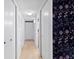 Hallway with wooden floors, ample storage, and a decorative wallpaper accent wall at 387 Ralph Mcgill Ne Blvd # K, Atlanta, GA 30312