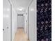 Hallway area with hardwood floors, closet storage, and stylish wallpaper design at 387 Ralph Mcgill Ne Blvd # K, Atlanta, GA 30312