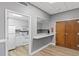 A well-equipped kitchenette featuring white cabinets, appliances, and a serving hatch to the common area at 387 Ralph Mcgill Ne Blvd # K, Atlanta, GA 30312