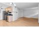 An open-concept living area with stainless steel appliances and hardwood flooring for a sleek look at 387 Ralph Mcgill Ne Blvd # K, Atlanta, GA 30312