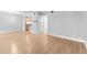 Open-concept living space with hardwood floors seamlessly flowing into a kitchen with modern lighting fixtures at 387 Ralph Mcgill Ne Blvd # K, Atlanta, GA 30312